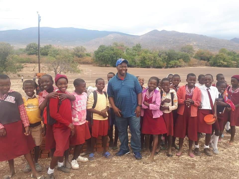 Terence and Zimbocare team with happy students at Tsenga Primary