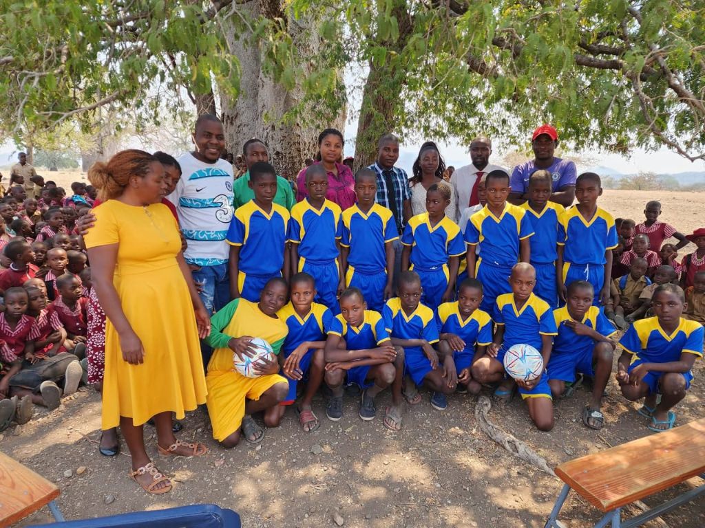 Community, teachers, and Zimbocare team at the sports kit handover